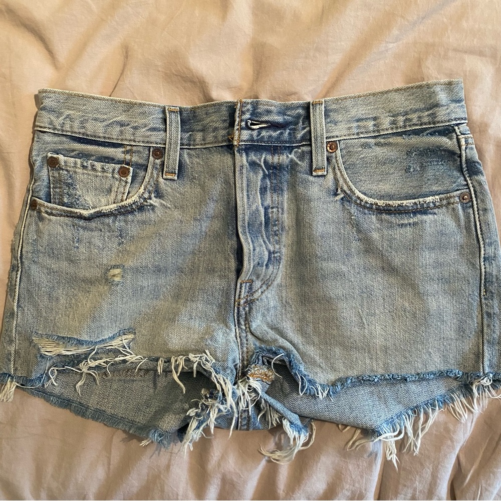 Distressed Levi’s 501 denim shorts. Size 27